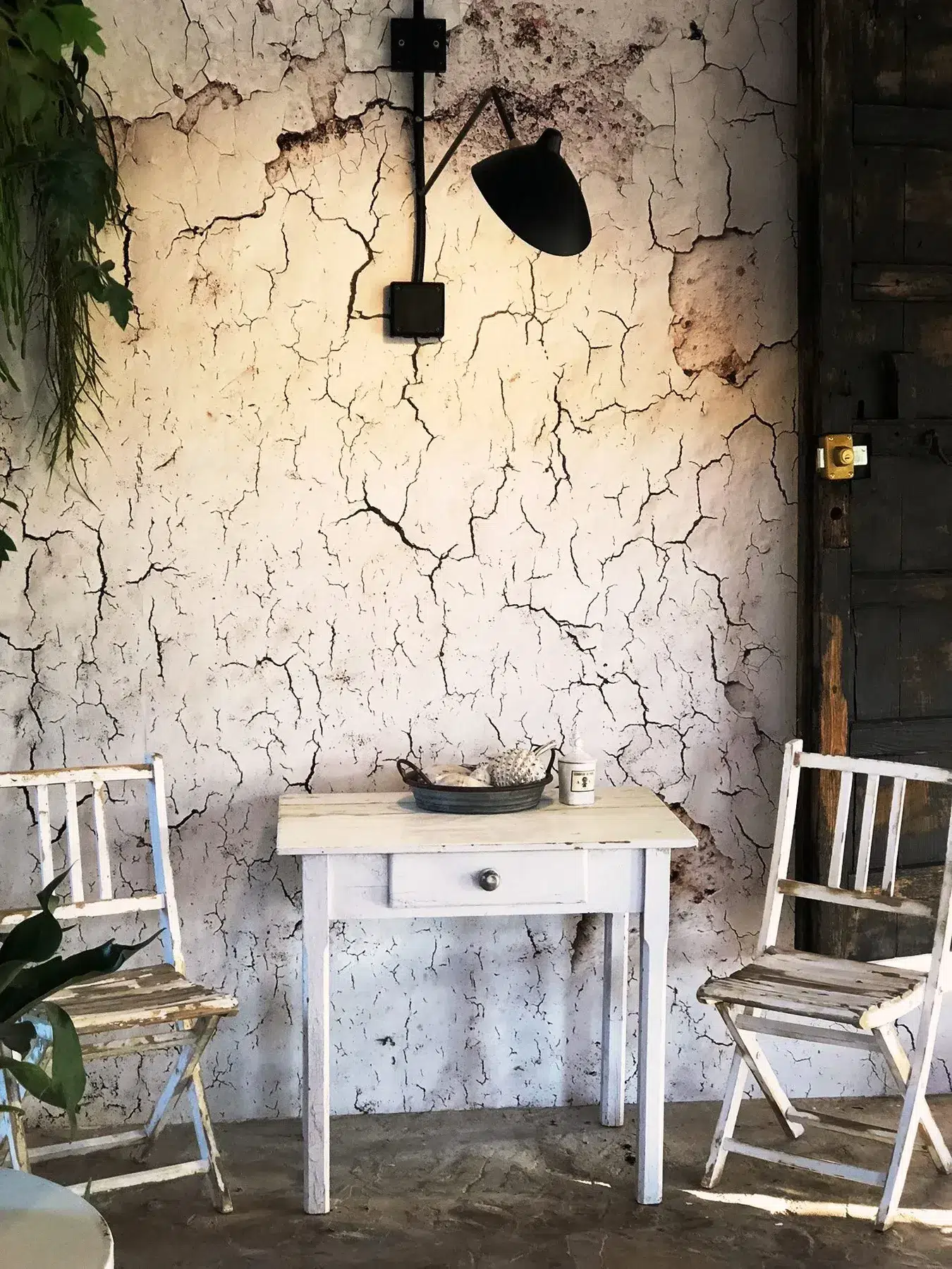 "Cracked wall" wallpaper in the wintergarden restaurant at Finca Legado